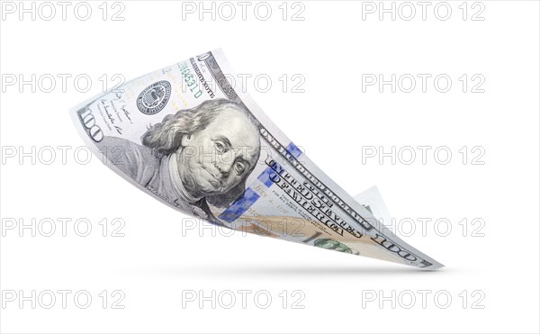 One hundred dollar bill floating down to surface with drop shadow isolated on a white background