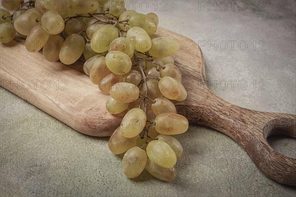 A branch of white grapes, wine grapes, Georgian grape variety Rkatsiteli, top view