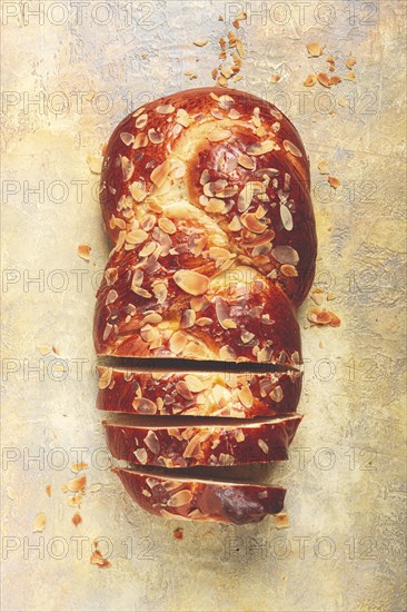 Braided, sweet bread pie, with sliced almonds, breakfast, braided bread, brioche, on a light