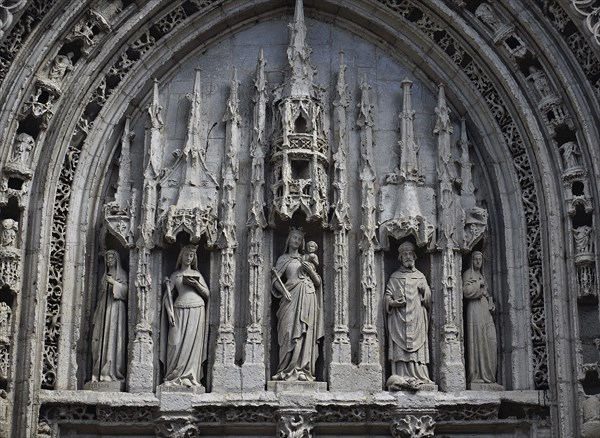 Tympanum at the Sainte Radegonde church (Poitiers, France) . Sainte Radegonde is 2th from left,