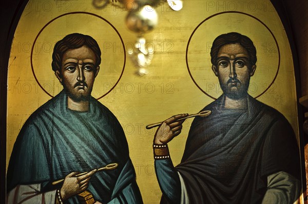 Painting representing Cosmas and Damian at the Sts Anargyroi church in Nairobi Kenya . Cosmas and