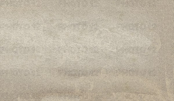 Beige plastered wall with rough texture creating a neutral background