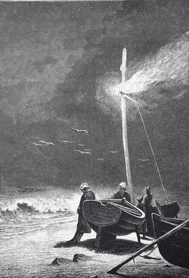 Fishermen wait in the evening for the last boat to return, Men at night illuminate boats in a