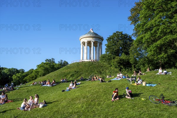 Monopteros in the English Garden, people enjoying the summer day in the park, Munich, Upper