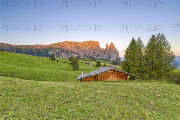 Alpine hut in front of Schlern, Seiser Alm, sunrise, Dolomites, South Tyrol, Italy, Europe