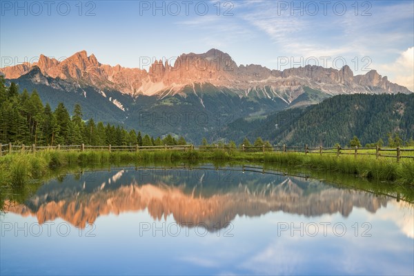 Mountains reflected in a small mountain lake, sunset, evening light, Wuhnleger Weiher, view of rose
