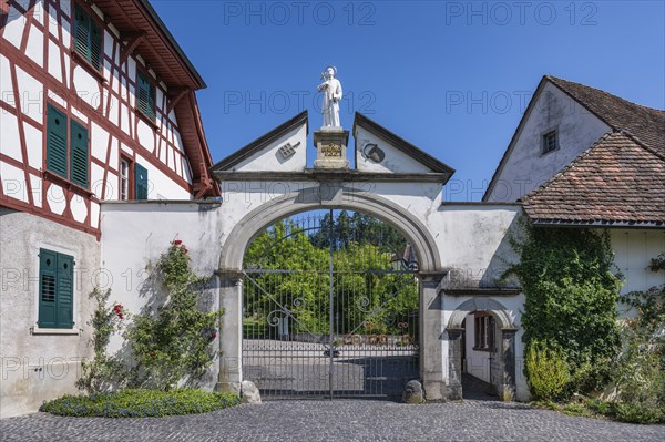 Lower entrance to Ittingen Charterhouse, a former Carthusian monastery with a statue of Bruno of