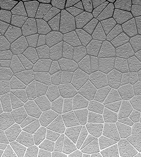 Abstract geometric pattern with textured gray shapes resembling a mosaic