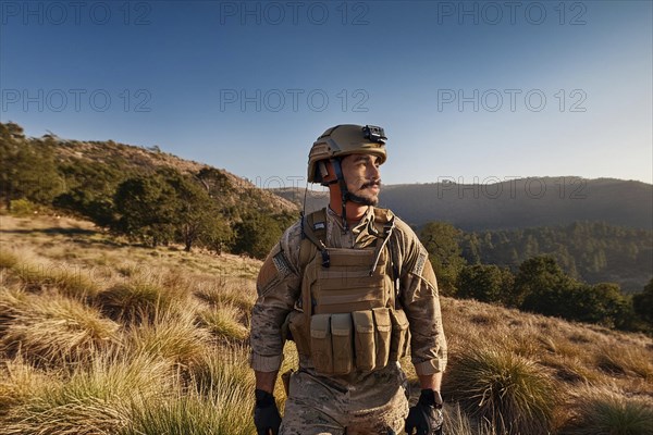 Soldier in uniform and helmet stands in a hilly landscape under a blue sky, AI generated, AI