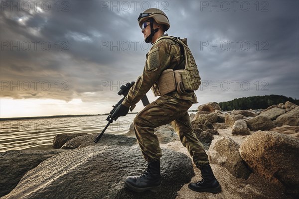 A soldier in uniform and helmet with a weapon stands on rocks by the ocean under a stormy sky, AI