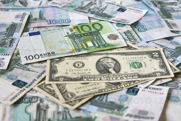 Background of paper bills dollars, euros and rubles. Currency exchange rate