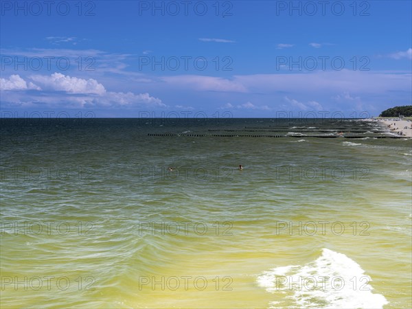 Sandy beach beach with clouds in the blue sky on the island of Usedom on the Baltic Sea, Zempin,