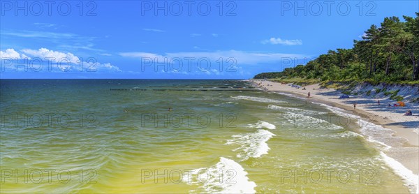 Sandy beach beach with clouds in the blue sky on the island of Usedom on the Baltic Sea, Zempin,