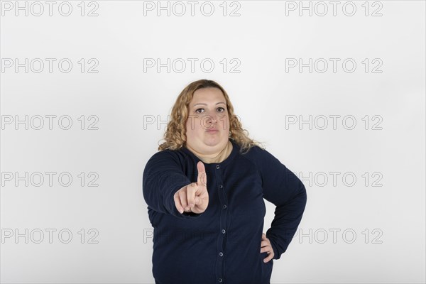 Plus size woman making an objection with her hand