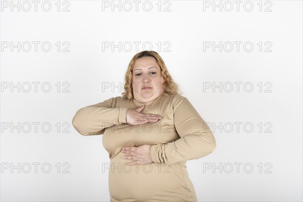 Plus size woman doing a Breast Self-Exam (BSE)