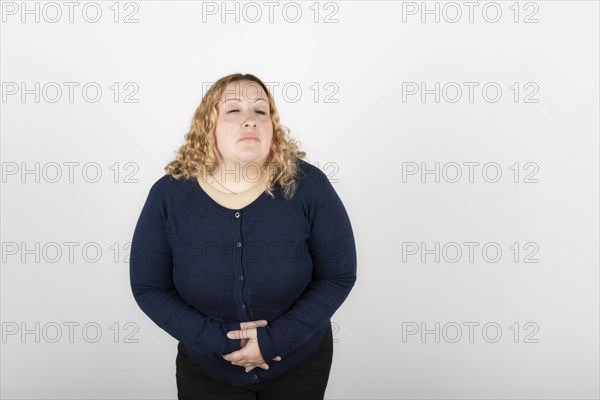 Woman with stomach ache on white background