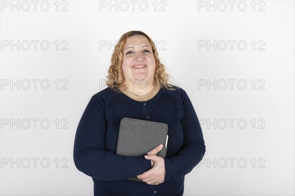 Portrait of blonde plus size woman looking at camera smiling