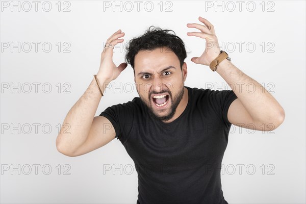 Latin young man arguing loudly