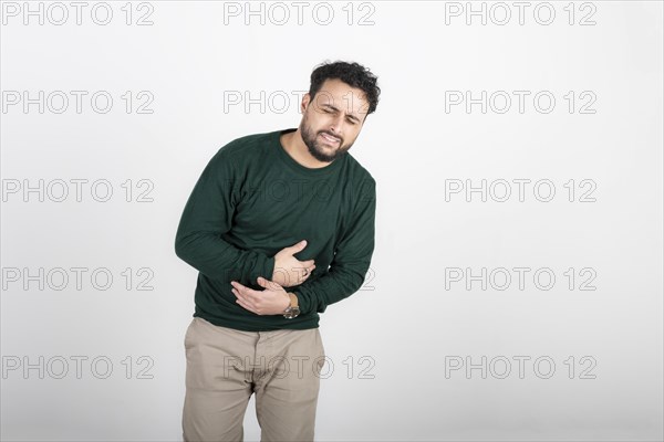 Man with stomach ache on white background