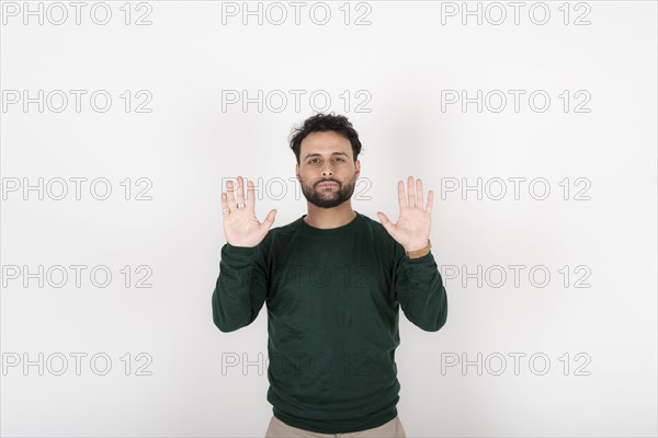 Man showing palm hands. White background