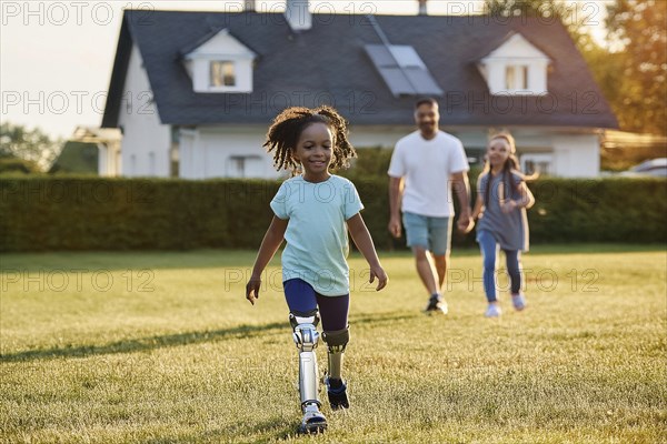 Joyful girl with prosthetic leg runs in the garden, followed by her father and sister, ai