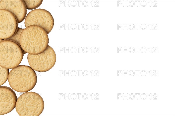 Group of double biscuits at the left edge of the picture, on white, copying room