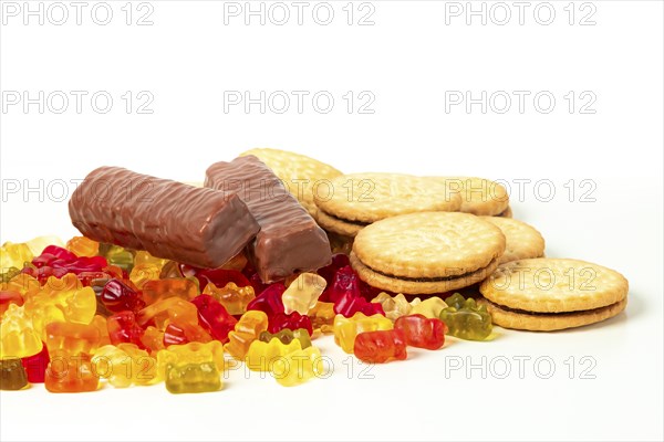 Sweets, jelly bears, biscuits and chocolate bars, on white, copy room