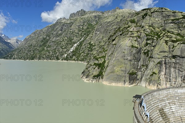 The well-filled Grimselsee reservoir with the Spitallamm wall, Guttannen, Canton Bern, Switzerland,