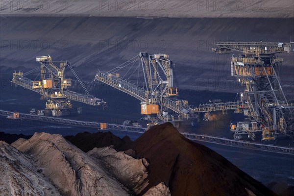 Lignite excavators extract coal in the Welzow open-cast mine, operated by LEAG. The lignite is