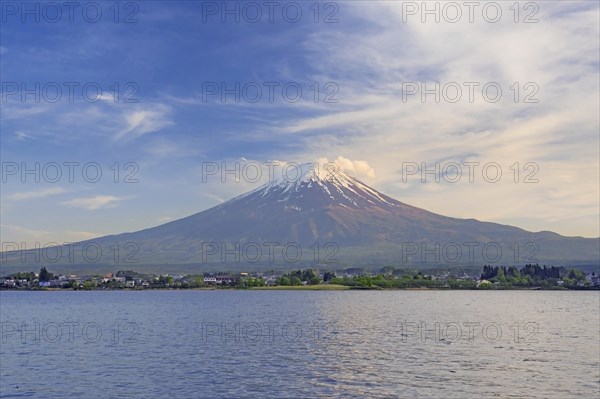 Mount Fuji in spring, active stratovolcano showing volcanic cone seen from across Lake Sh? ji on