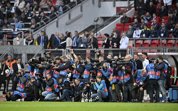 Crowd of press photographers, many sports photographers, UEFA jerseys, international match, Max