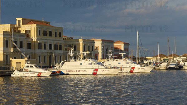Evening light, harbour, Italian coast guard ships, close, harbour front buildings, Catania, east