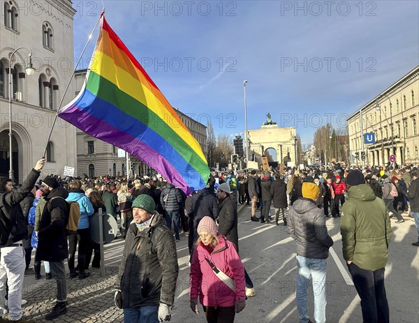 LGBTQ flag, crowd at the demonstration against right-wing extremism in front of the Siegestor in
