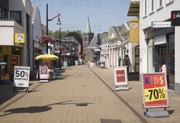 Almost deserted main shopping street at noon on very hot summer day, Sliedrecht, Netherlands