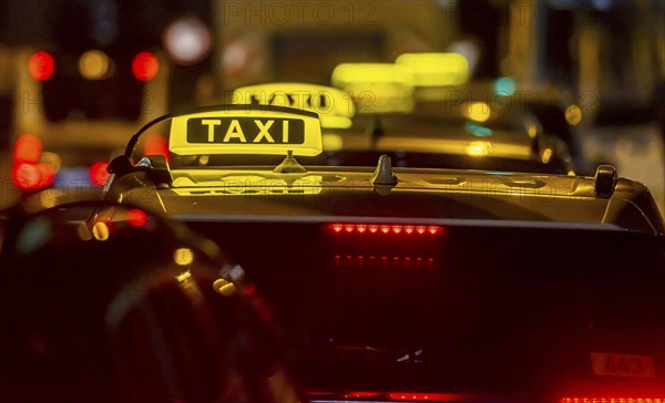 Illuminated taxi sign in the evening, symbolic photo, Stuttgart, Baden-Württemberg, Germany, Europe
