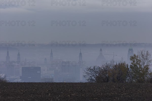 View from Dresden's Südhöhe of the city centre with its towers sinking into the fog