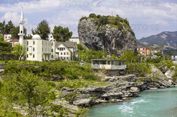 Town view of Përmet with cube-shaped rock Guri i Qytetit with wall remains from Ottoman times.