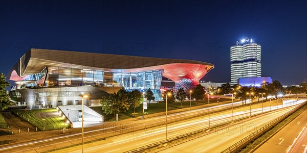 BMW World and the BMW four-cylinder administration building at night, Munich, Bavaria, Germany,