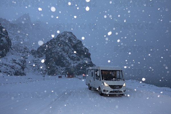 With motorhome in winter snowfall on Andoya, Vesteralen, Norway, Europe