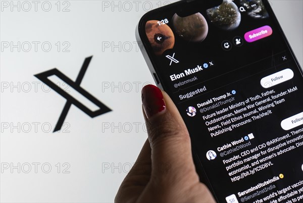 In this photo illustration a person browsing Elon musk X account, formerly Twitter, on an iPhone,