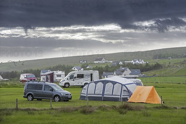 Campervans and tents on campsite along Loch Gairloch, Wester Ross, North-West Scottish Highlands,