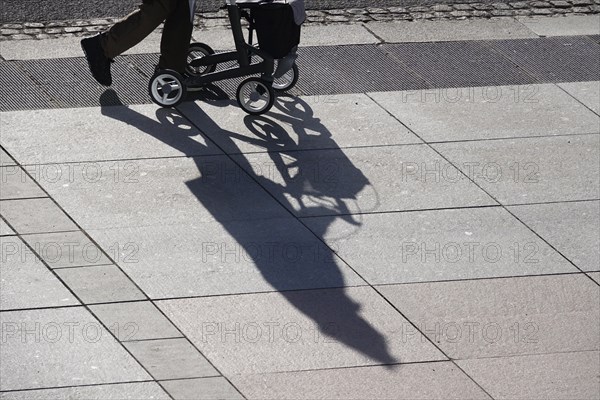 Passers-by with rollator, shadow, winter, Saxony, Germany, Europe