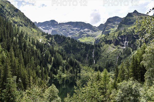 The hut lake and waterfalls at the Hans-Wödl-Hütte, Schladminger Tauern, Styria, Austria, Europe