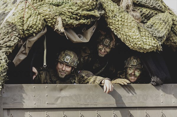 Czech soldiers drive through a forest as part of the military exercise 'Wettiner Schwert' with
