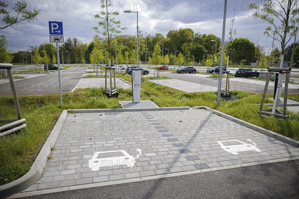 Symbolic photo. Parking spaces and charging points for electric cars are located in a newly built