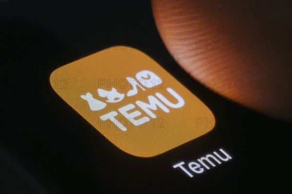 The logo of the Temu app (online marketplace) from Chinese company PDD Holdings can be seen next to