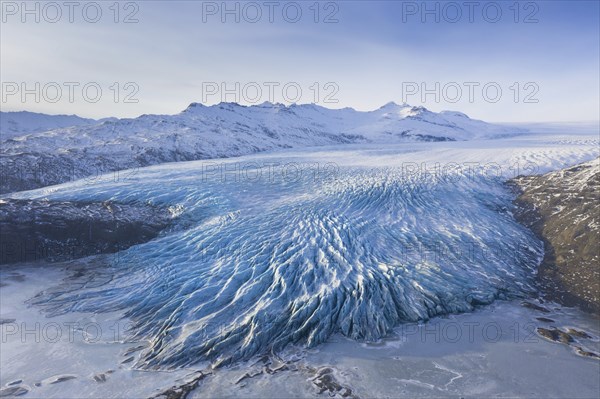 Aerial view over ice tongue Falljökull in winter, one of many outlet glaciers of Vatnajökull, Vatna