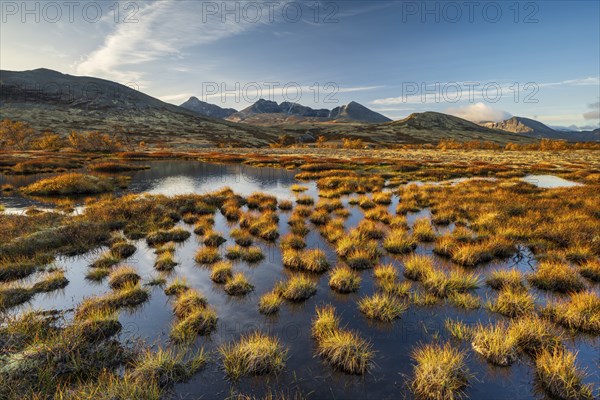 Autumn landscape in Rondane National Park, mountains Hogronden, Midtronden and Digerronden Doralen,