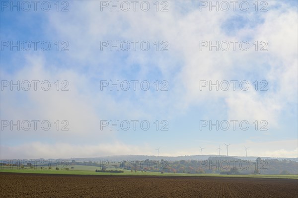 Field landscape, wind turbines, sky, clouds, autumn, beeches, Odenwald, Baden-Württemberg, Germany,