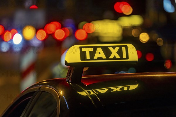 Illuminated taxi sign in the evening, symbolic photo, Stuttgart, Baden-Württemberg, Germany, Europe